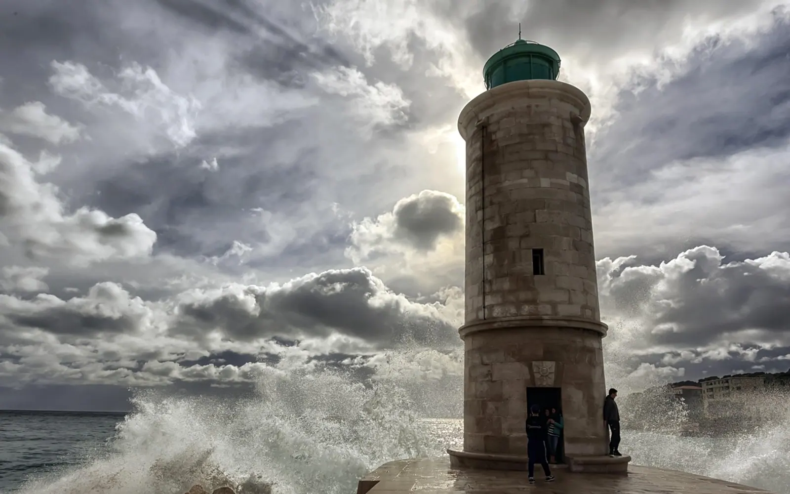 Lighthouse, crashing waves and tower