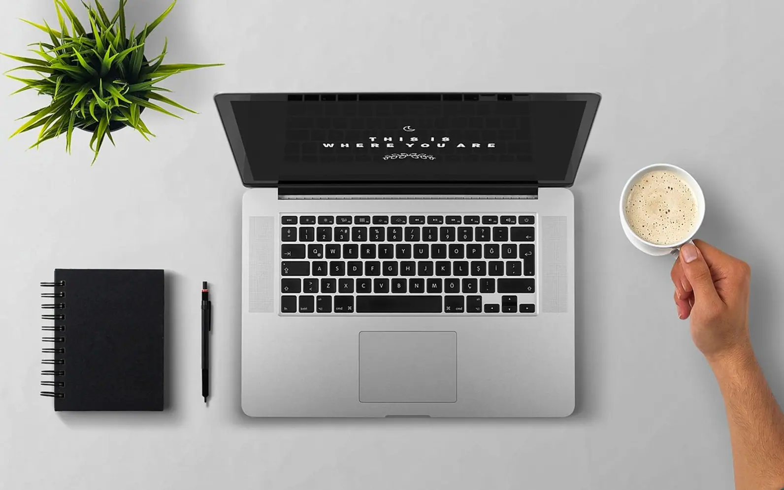 Laptop, coffee and arm